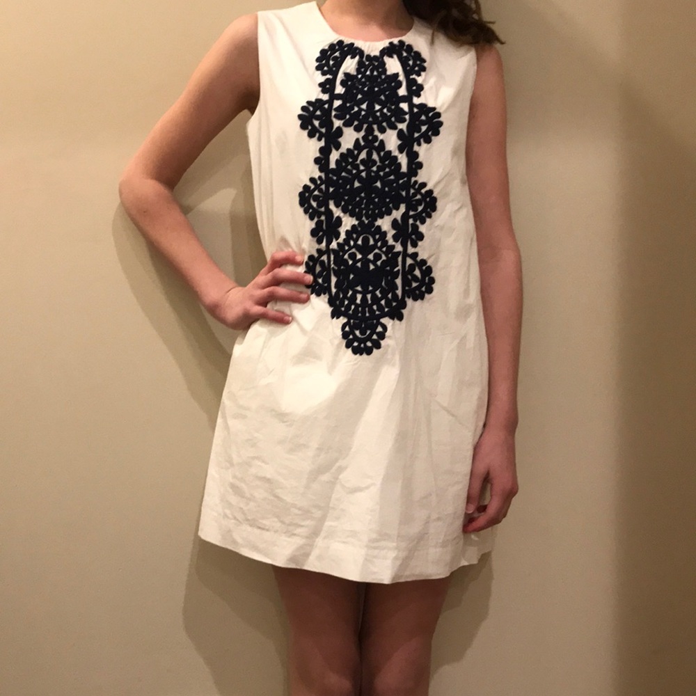 J Crew white dress with navy blue embroidery.